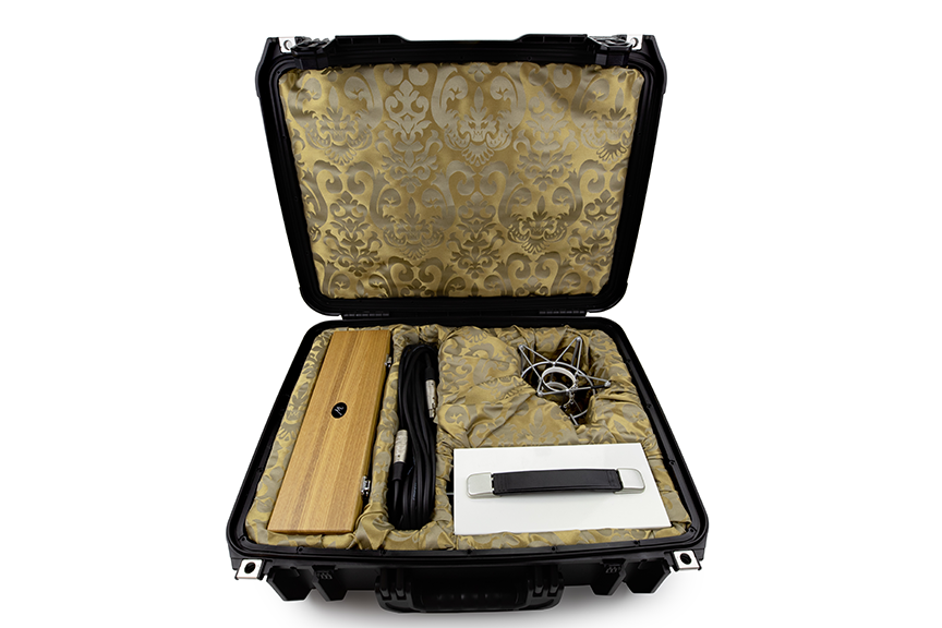 Monheim Microphones Crème tube condenser microphone in wooden box, with XLR and power cables, shockmount, and power supply all housed in black heavy-duty travel case lined in regal gold fabric.